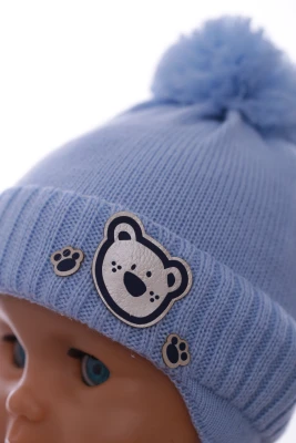 Шапка в'язка для хлопчика на трикотажі Миха блакитна
