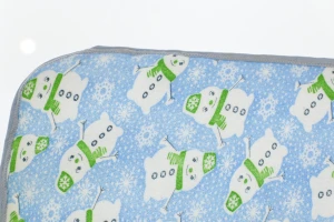 Клейонка-пелюшка для хлопчика блакитна Сніговик 50*70 см Murat Baby