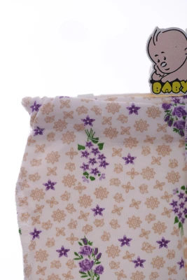 Повзунки трикотажні з бежевим квітами.